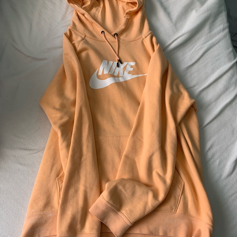Xl peach Nike sweatshirt, small stain on the k (marker)